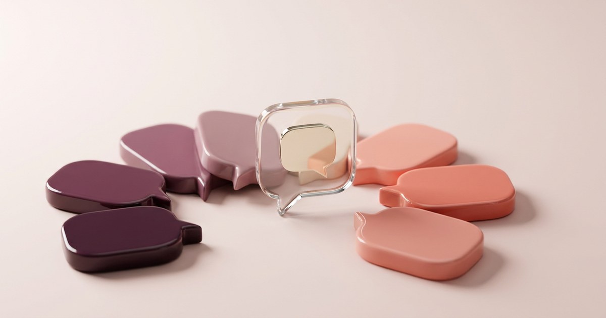 Seven glossy speech-bubble shaped tiles fanned out on a pale blush surface, shading from deep plum on the left through mauve to soft coral on the right, with a clear glass tile at the centre holding a smaller cream bubble inside it.